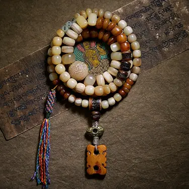 Carved bead and metal detail